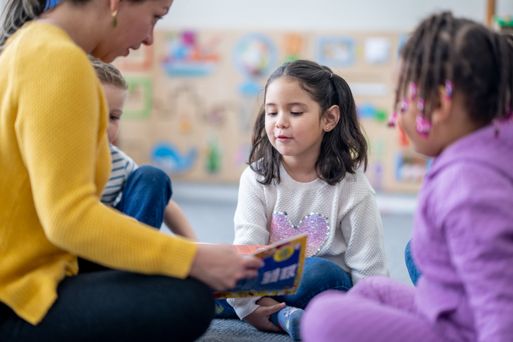 Students and a teacher in a classroom
